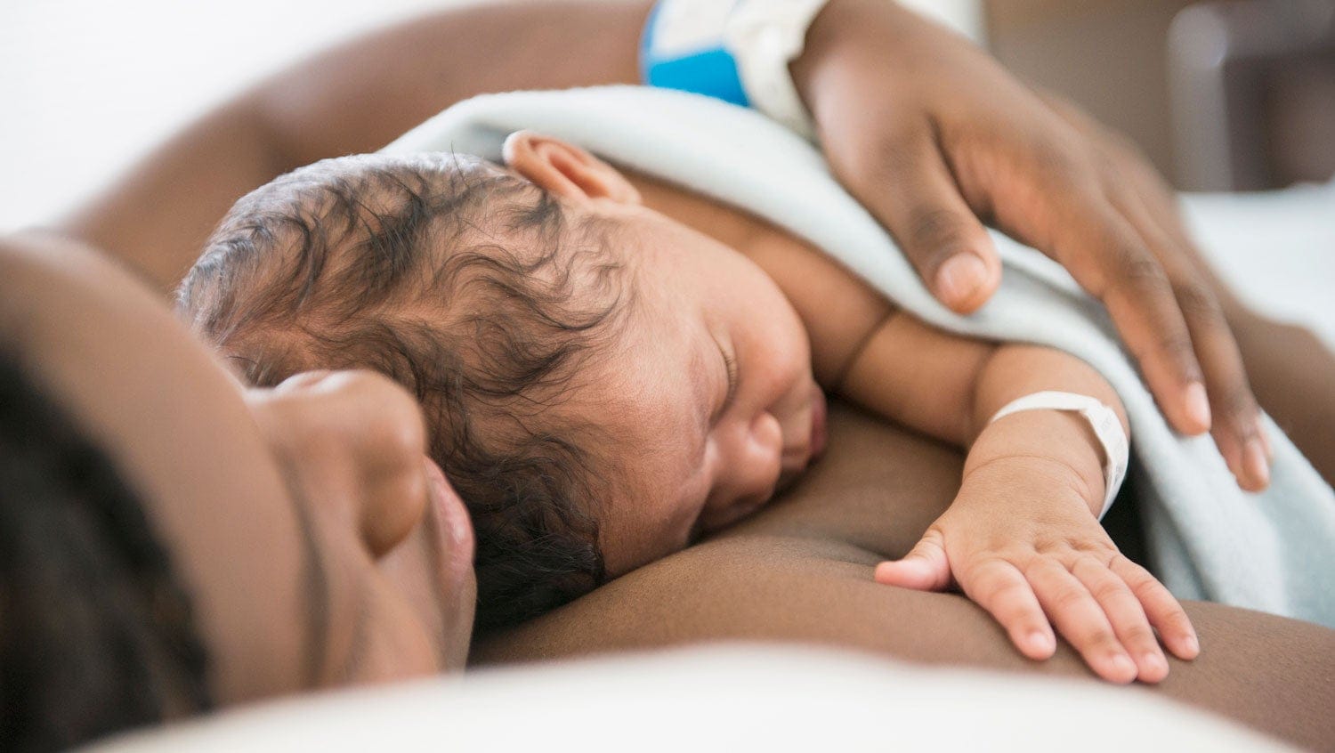 black mother and baby practice skin-to-skin care in hospital