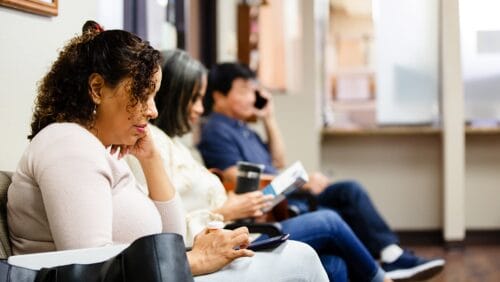 people waiting in an emergency room