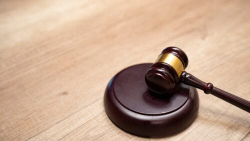 a judge's gavel sits on a table