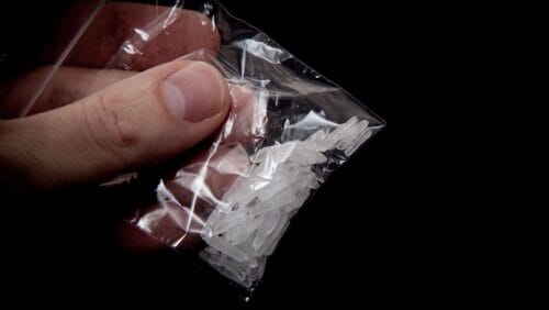 Close up of a baggie of meth, a drug with rates on the rise in the opioid crisis