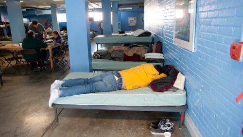 Guests at Pine Street Inn lay on cots