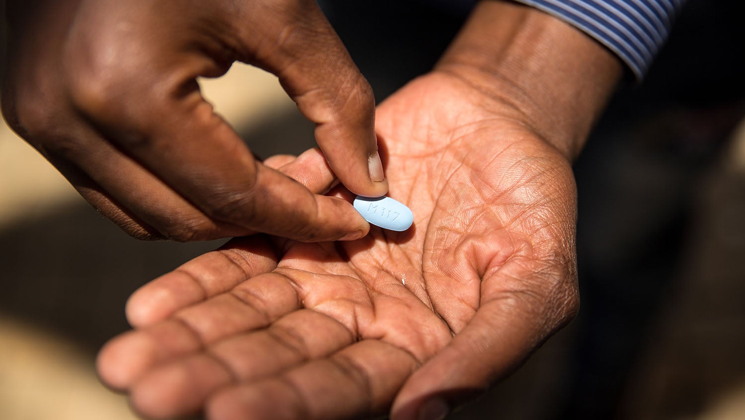 hiv prep medication in a mans hand