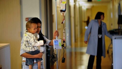 child and adult with sickle cell disease type sickle cell anemia in a hospital