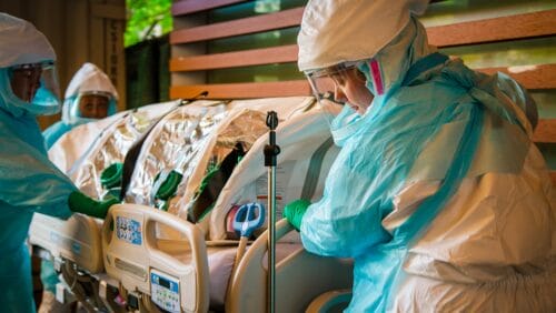 boston medical center special pathogens unit with nurse in full PPE