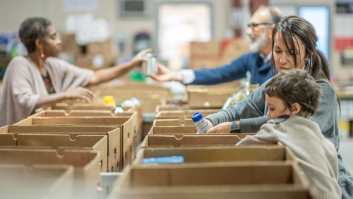 volunteers work at a food bank