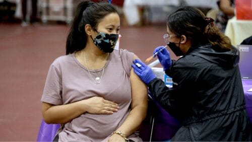 Pregnant woman receiving a vaccine