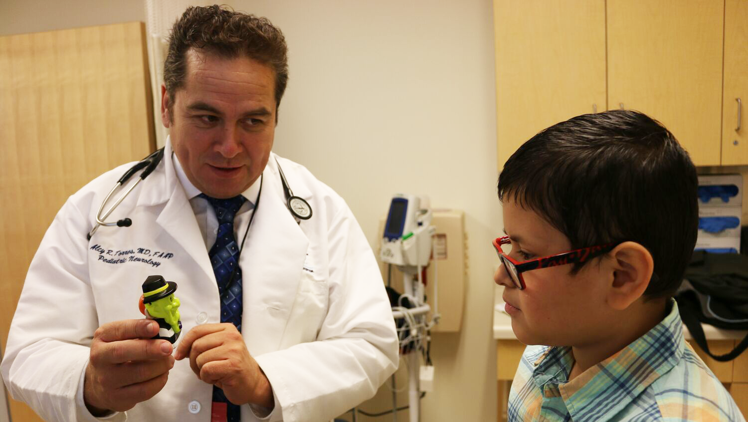 Dr. Alcy Torres with patient