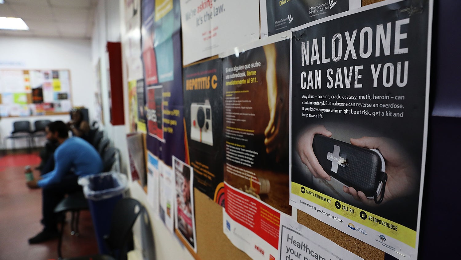 Posters about naloxone at addiction counseling meeting
