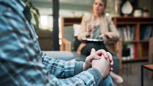 white man patient meeting with his therapist