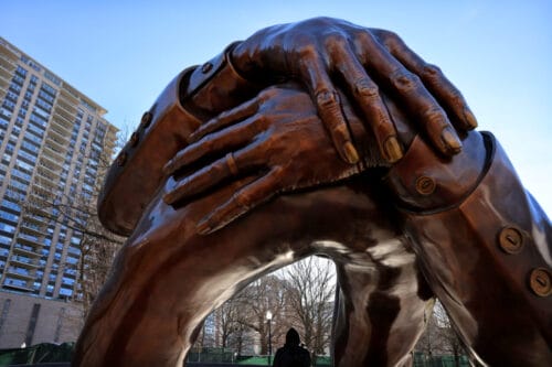 embrace statue of dr. martin luther king, jr. on the boston common.