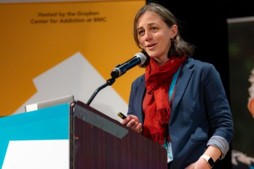 Sarah Bagley, MD, MSc, takes the stage at BMC's Together for Hope: Boston Addiction Conference 2024. Friday, March 15th, 2024. Photo by Jeff Fernandes.