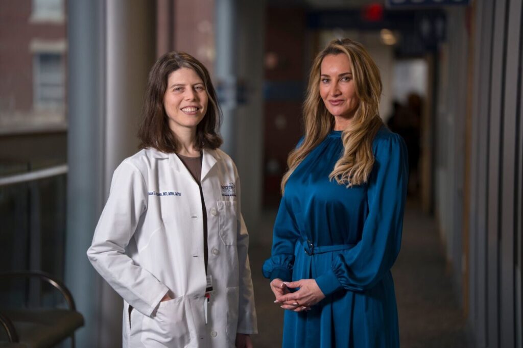 Anna Goldman, MD, MPH, MPA, primary care physician and medical director of sustainability at BMC (left), and Johanna Jobin, Global Head of Environmental Sustainability & Compliance at Takeda (right) meet to discuss the one-year report on BMC and Takeda’s cross-sector collaboration and its impact on environmental health, patient health, and long-term goals. March 3, 2026. Photo by Jodi Hilton.   
