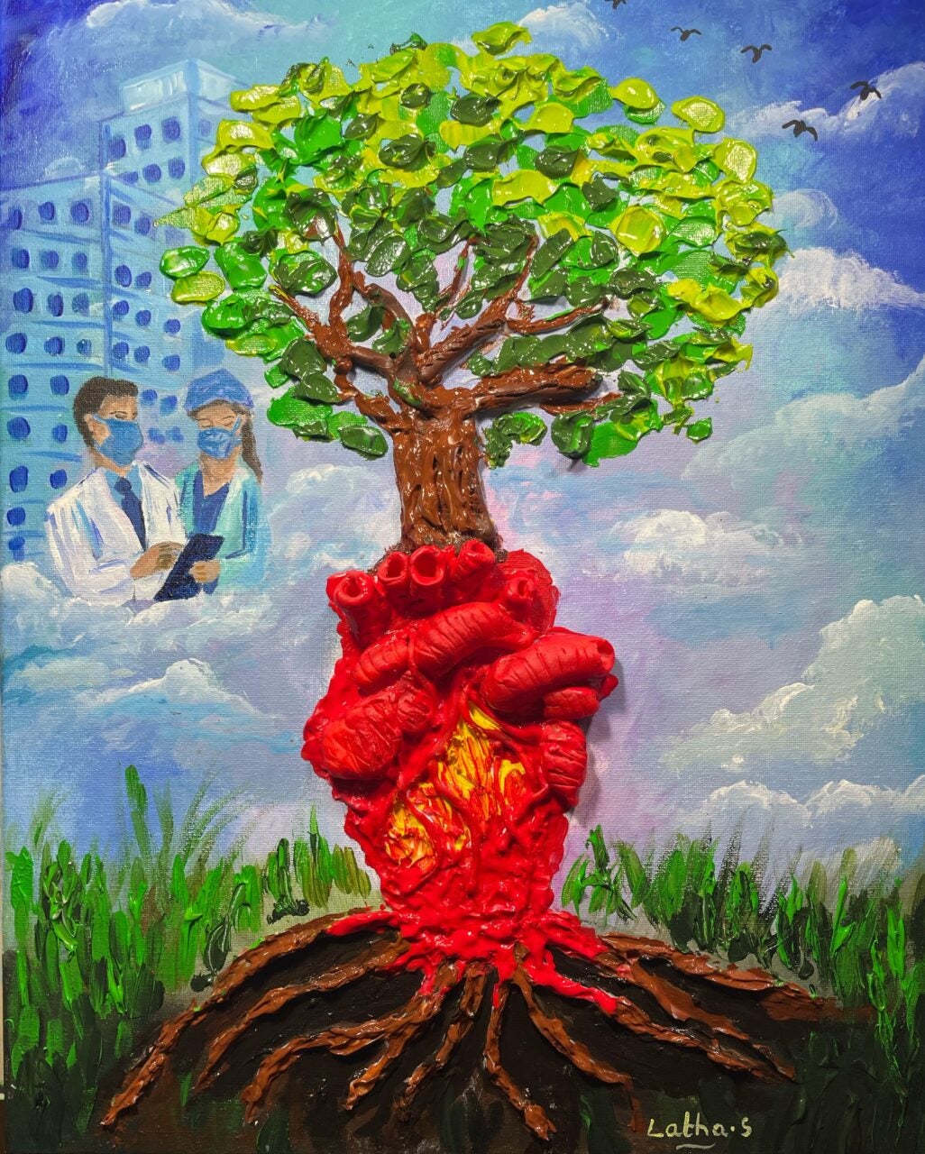 photo of an art piece in mixed media that depicts a red anatomical heart as a the base of a tree