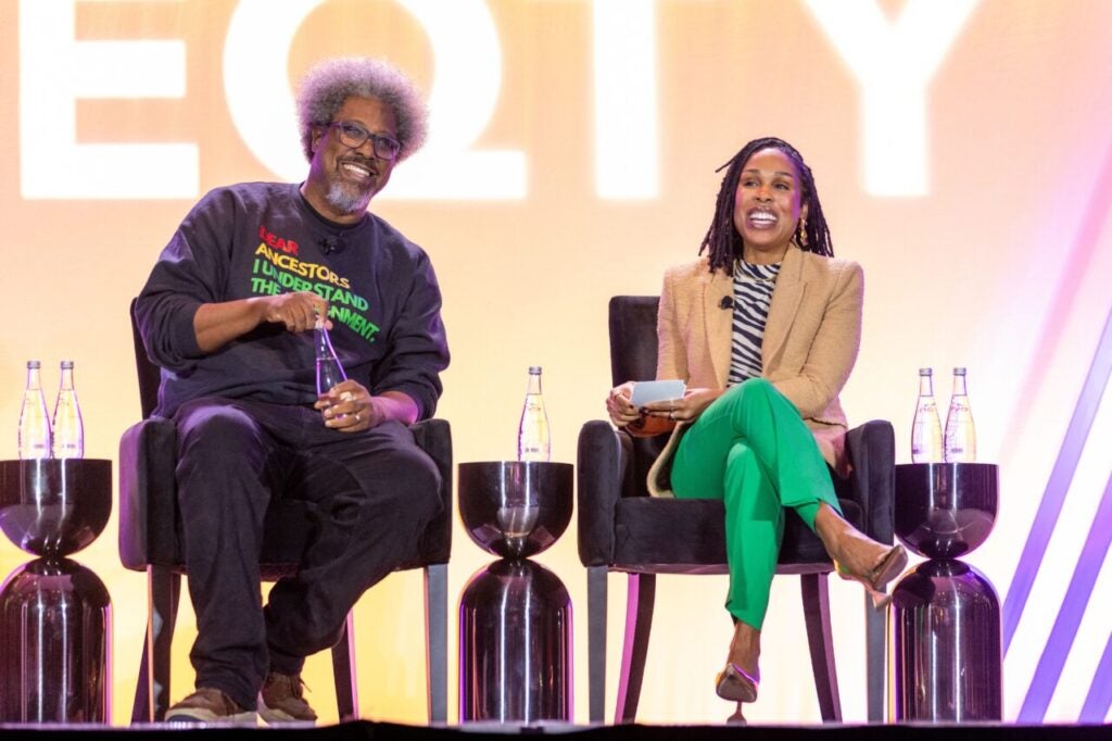 w. kamau bell and dr. uche blackstock sitting in chairs on stage at EQTY 2026