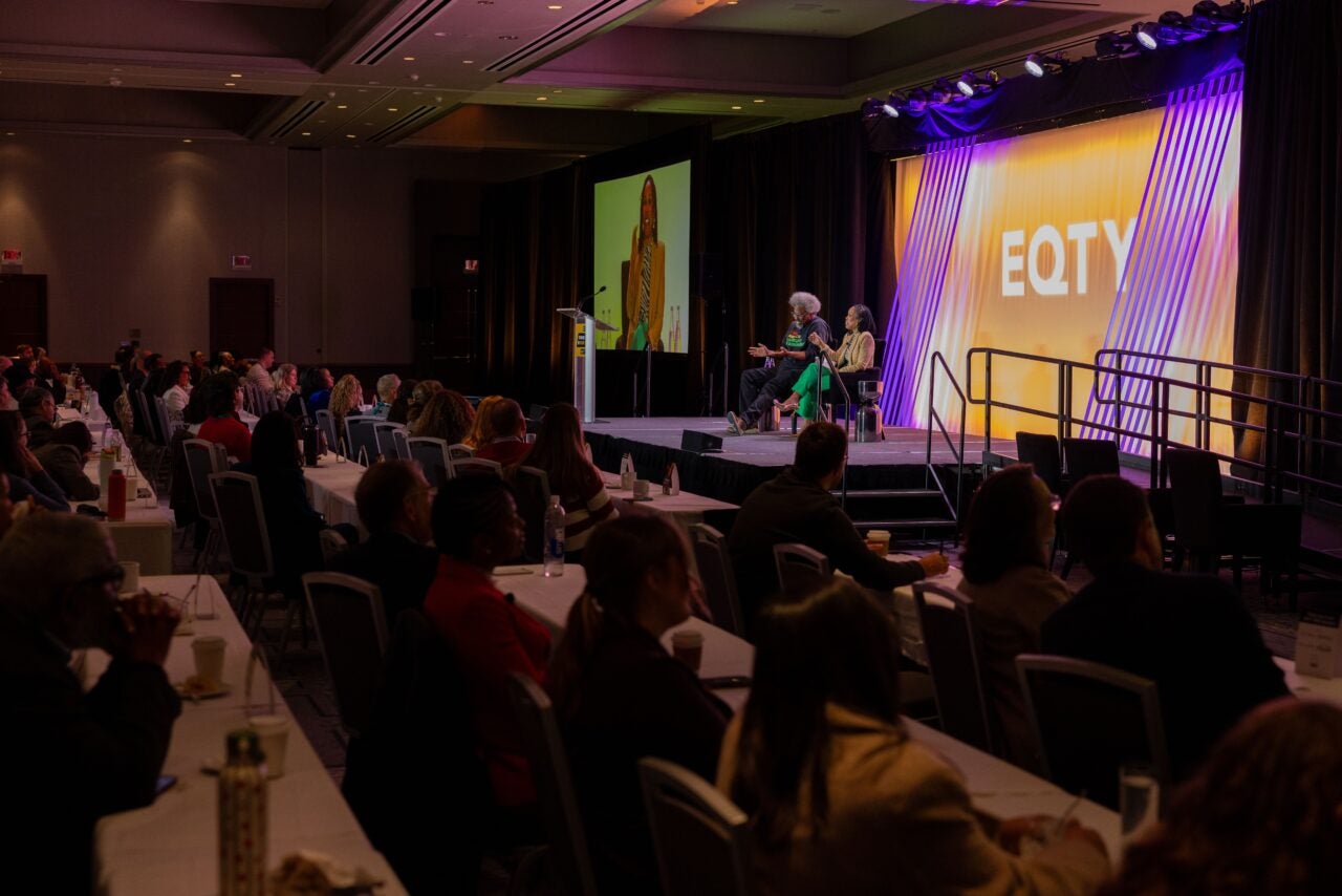 w. kamau bell and dr. uché blackstock speak on stage at EQTY 2026